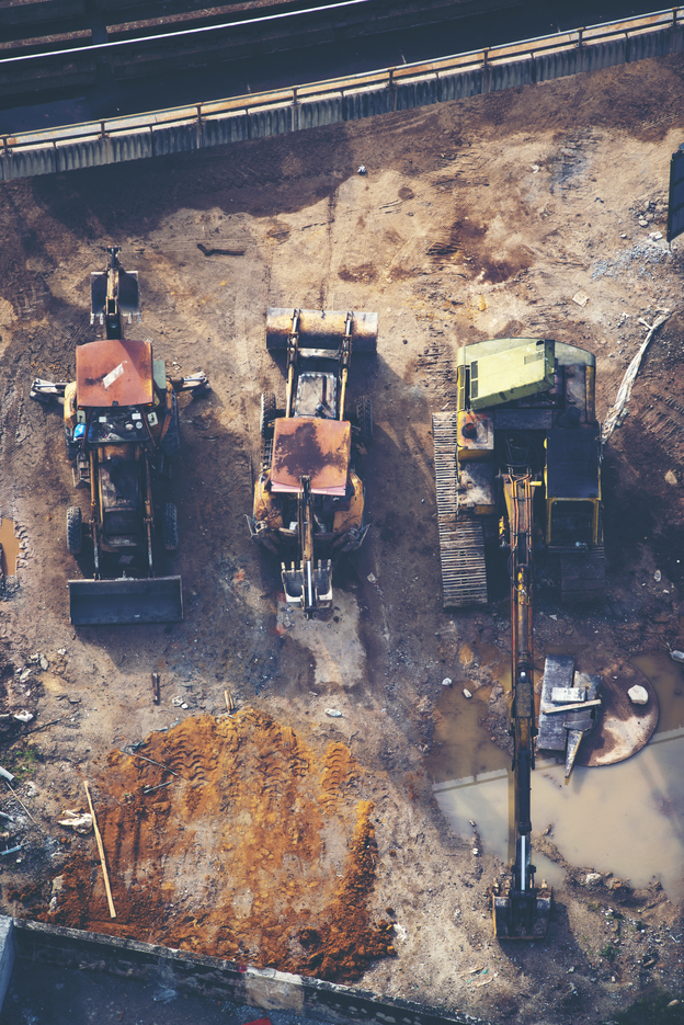 Construction sites include tractors and machinery.